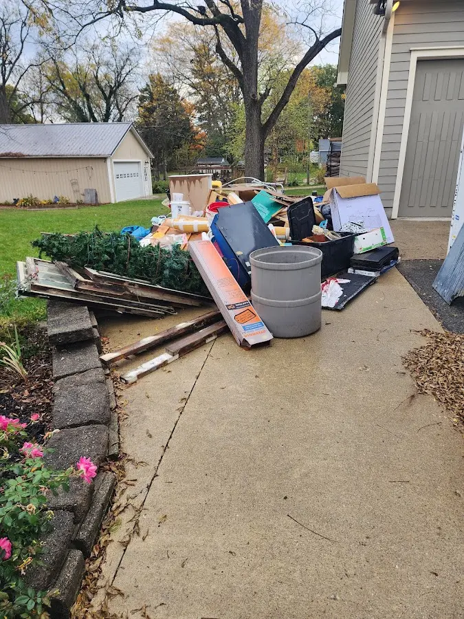 Dumpster being loaded with debris for Residential Dumpster Rental in Southwest Ranches